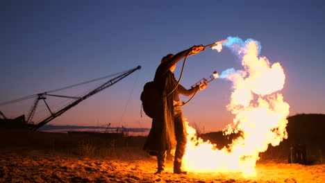 A-man-with-a-flamethrower-at-sunset-in-slow-motion.-Costume-for-zombie-Apocalypse-and-Halloween